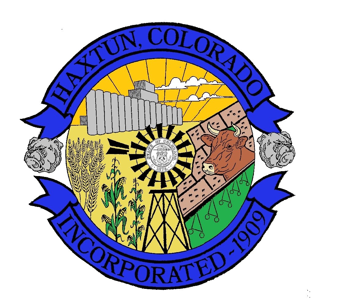 Official Town of Haxtun Seal depicting cornfields, silos, a windmill, and a steer